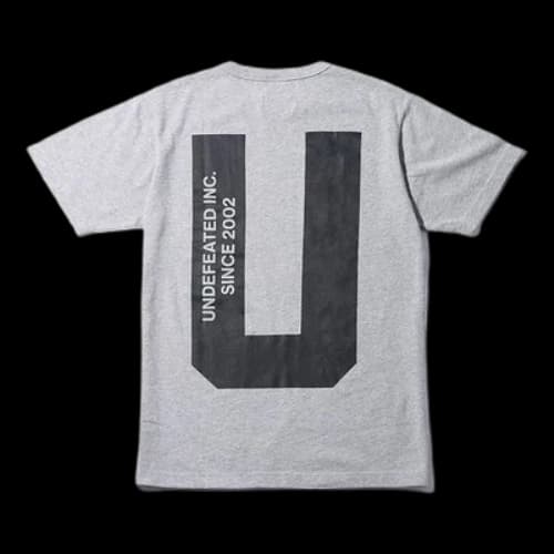 UNDEFEATED X CHAMPION Crossover Back Large U Logo Short Sleeve Gray